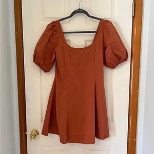 Medium Olivaceous orange puff sleeve A-line dress.